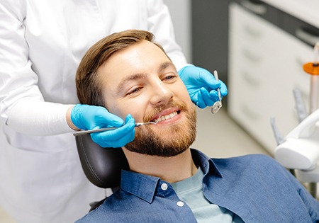 Patient and dental team member reviewing X-ray