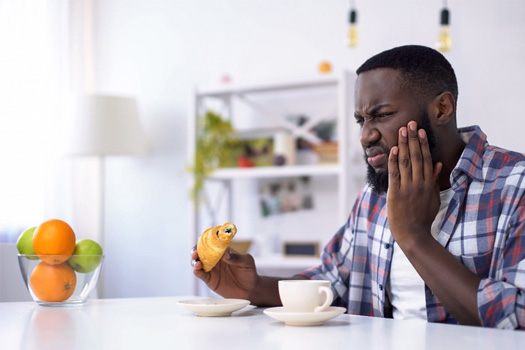 Man with tooth sensitivity