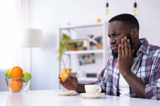 Man with sensitive tooth
